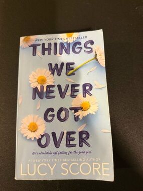 Things We Never Got Over by Lucy Score - Light Blue with White Daisies